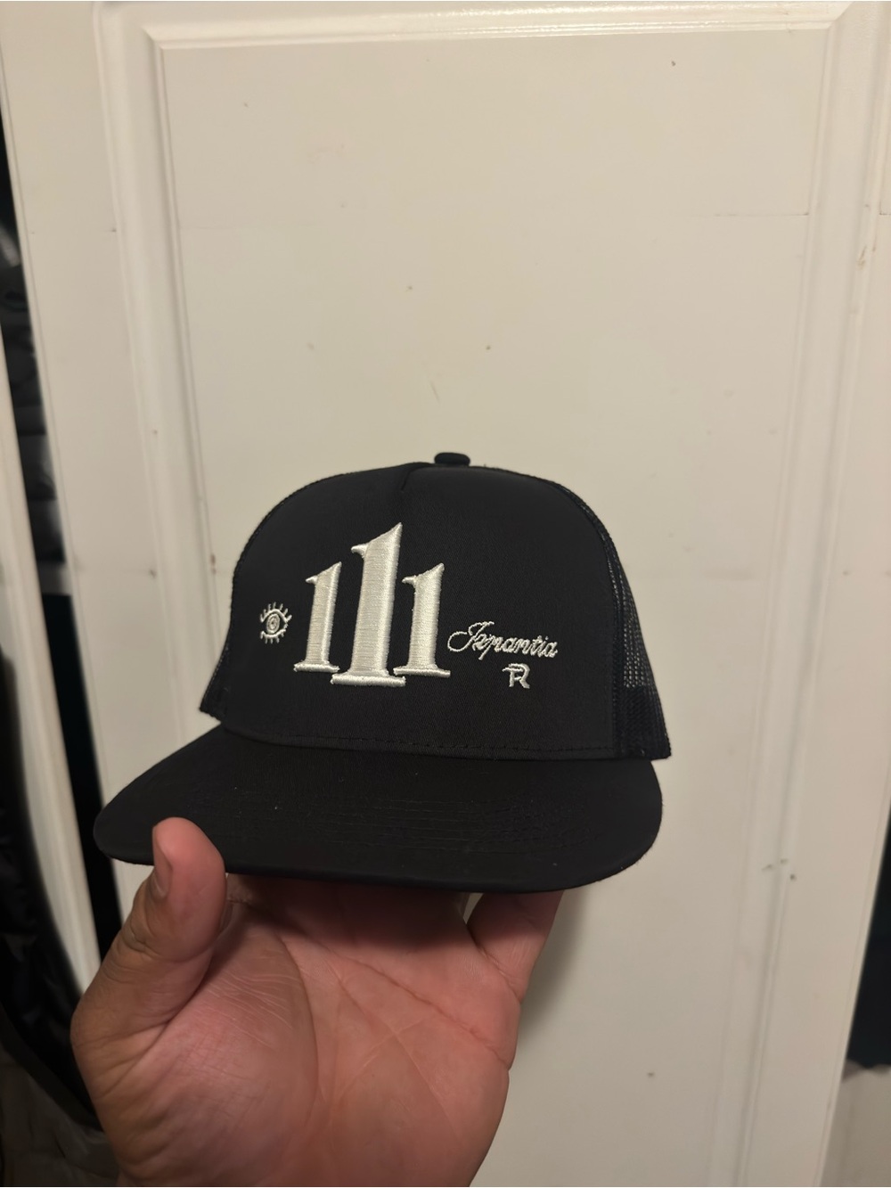 Black Trucker Hat with White Embroidery - 111 Design